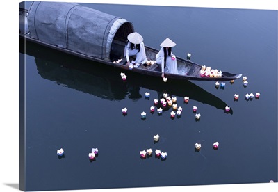 Vietnamese Girls Drop Floating Candles On A River In Hue To Pray For The Dead, Vietnam
