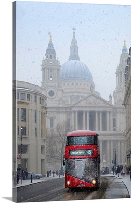 View Of A Red London Bus In Front Of St Paul's Cathedral In The Snow, London, England