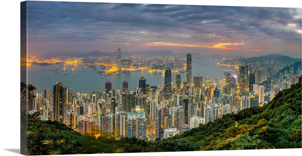 Panoramic view of Hong Kong skyline at dawn from Lugard Road on Victoria Peak, Hong Kong Island, Hong Kong, China.