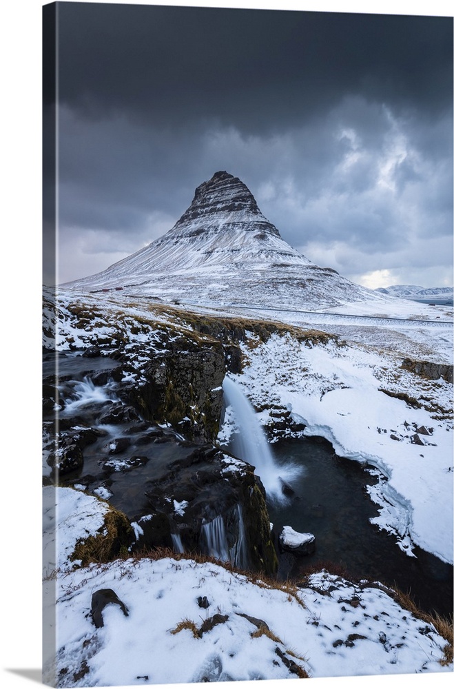 View of Kirkjufell mount at sunset in winter. Grundarfjorour, Snaefellsnes peninsula, Vesturland region, Iceland