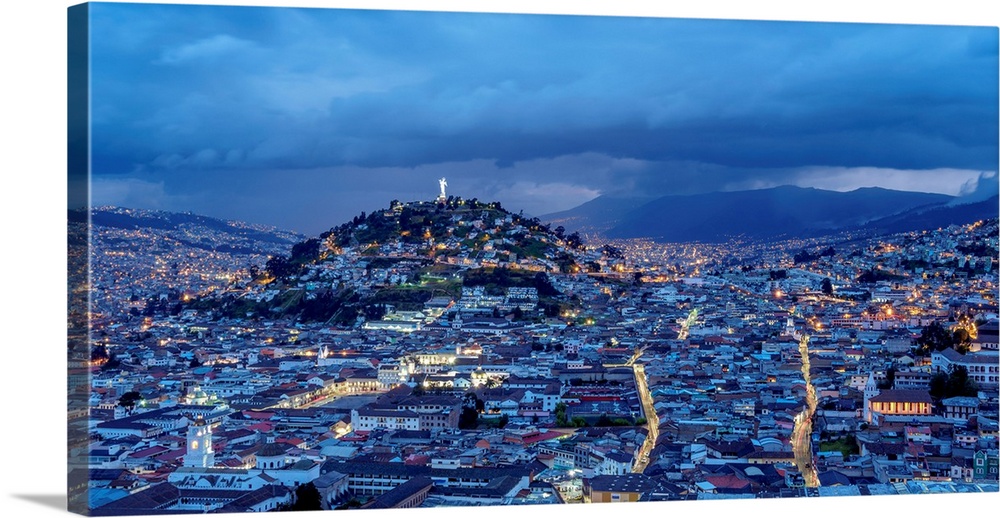 View over Old Town towards El Panecillo Hill at twilight, Quito, Pichincha Province, Ecuador.