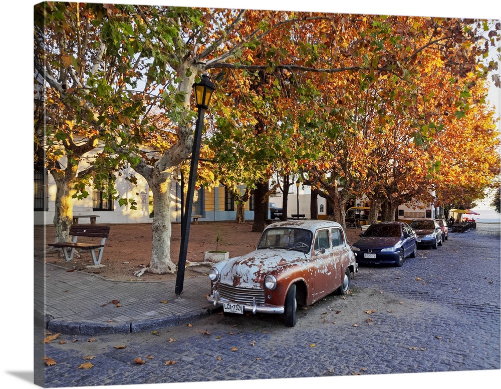 Uruguay, Colonia Department, Colonia del Sacramento, Vintage car on the cobblestone lane of the historic quarter.
