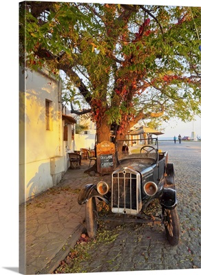 Vintage car on the cobblestone lane of the historic quarter, Uruguay