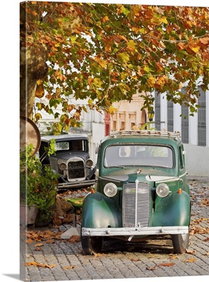 Vintage cars on the cobblestone lane of the historic quarter, Uruguay