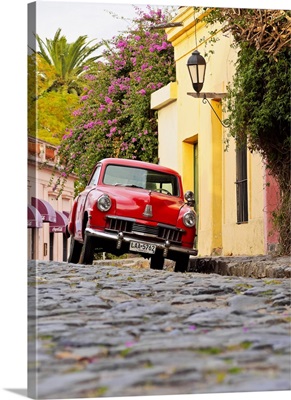 Vintage Studebaker car on the cobblestone lane of the historic quarter, Uruguay
