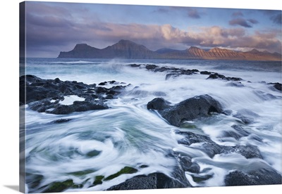 Waves break over the rocky shores at Gjogv on the island of Eysturoy, Faroe Islands