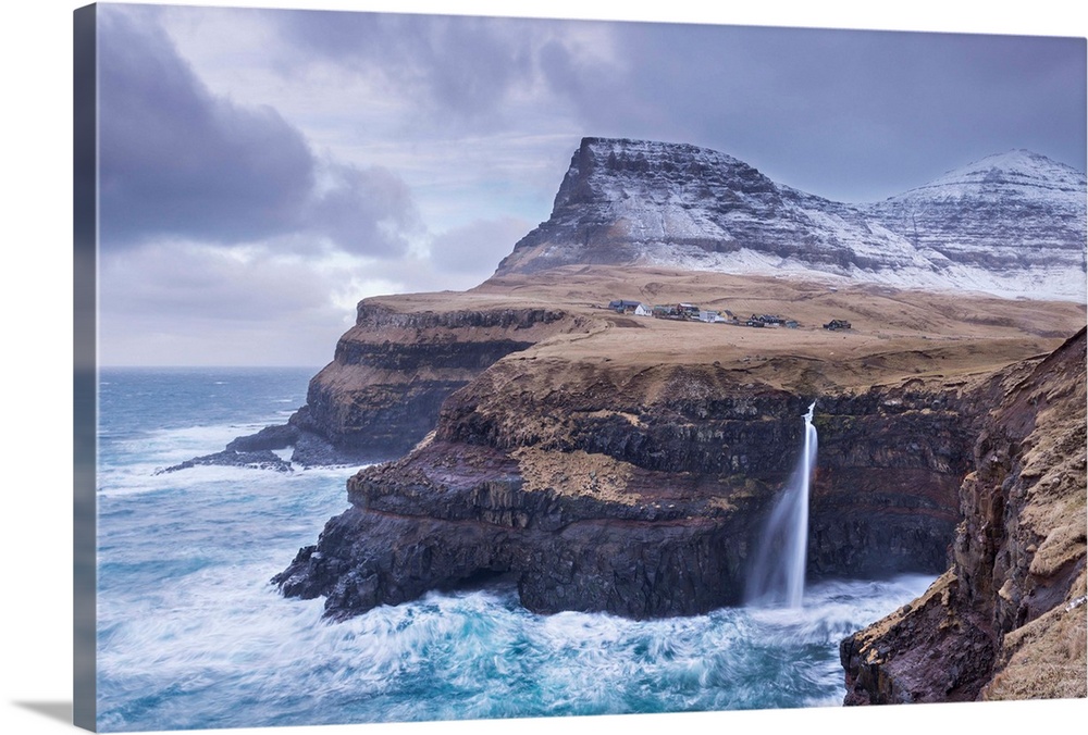 Wintry conditions at Gasadalur on the island of Vagar, Faroe Islands, Denmark, Europe. Winter (March) 2015.