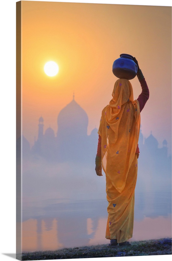 India, Water Carrying A Water Pot On A Foggy Morning With The Sun Rising On The Taj Mahal