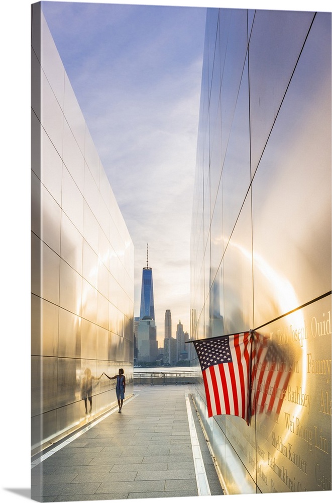 Woman walking through the Empty skies 9/11 memorial in Liberty state park, New York, USA.