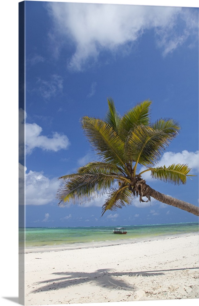 Zanzibar, Echo Beach. A boat anchored off the calm waters of the East coast of Zanzibar.