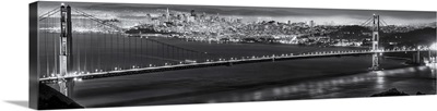 Golden Gate Bridge with Bay Bridge Illuminated in Background