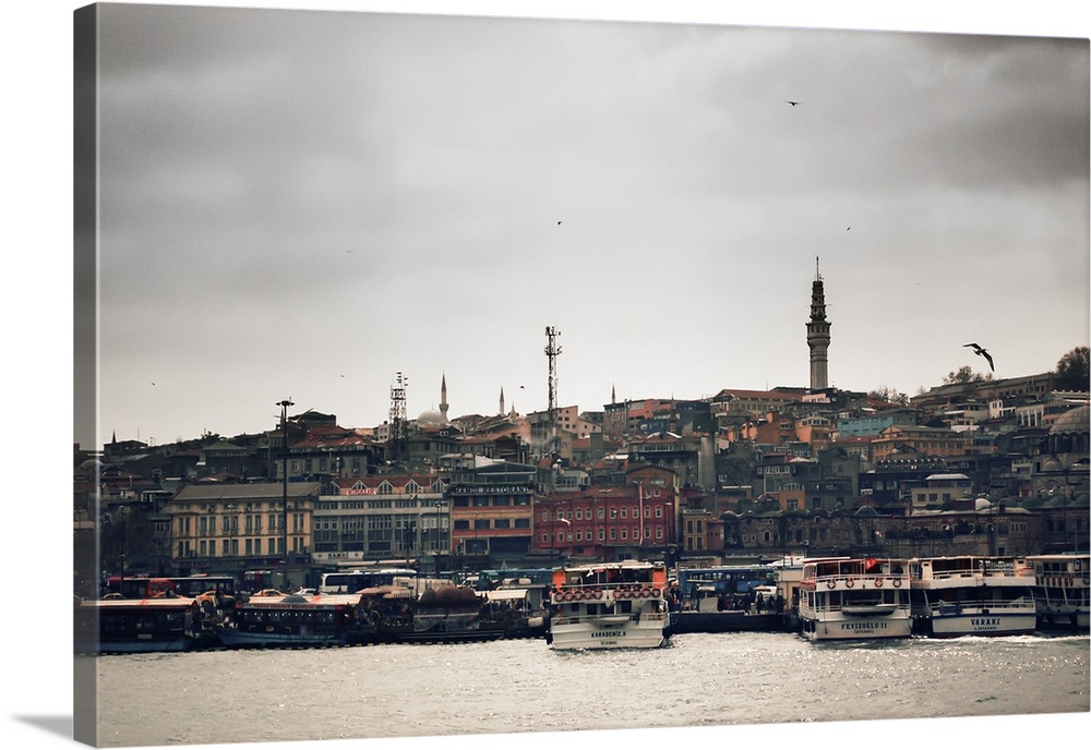 An offshore look of Istanbul from the Bosphorus River looking onto the mainland. Istanbul's skyline is filled with minaret...