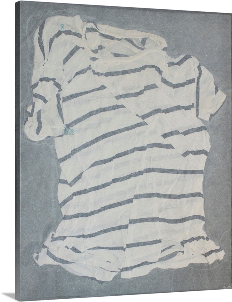 A striped, torn and mended t-shirt suspended in handmade paper.