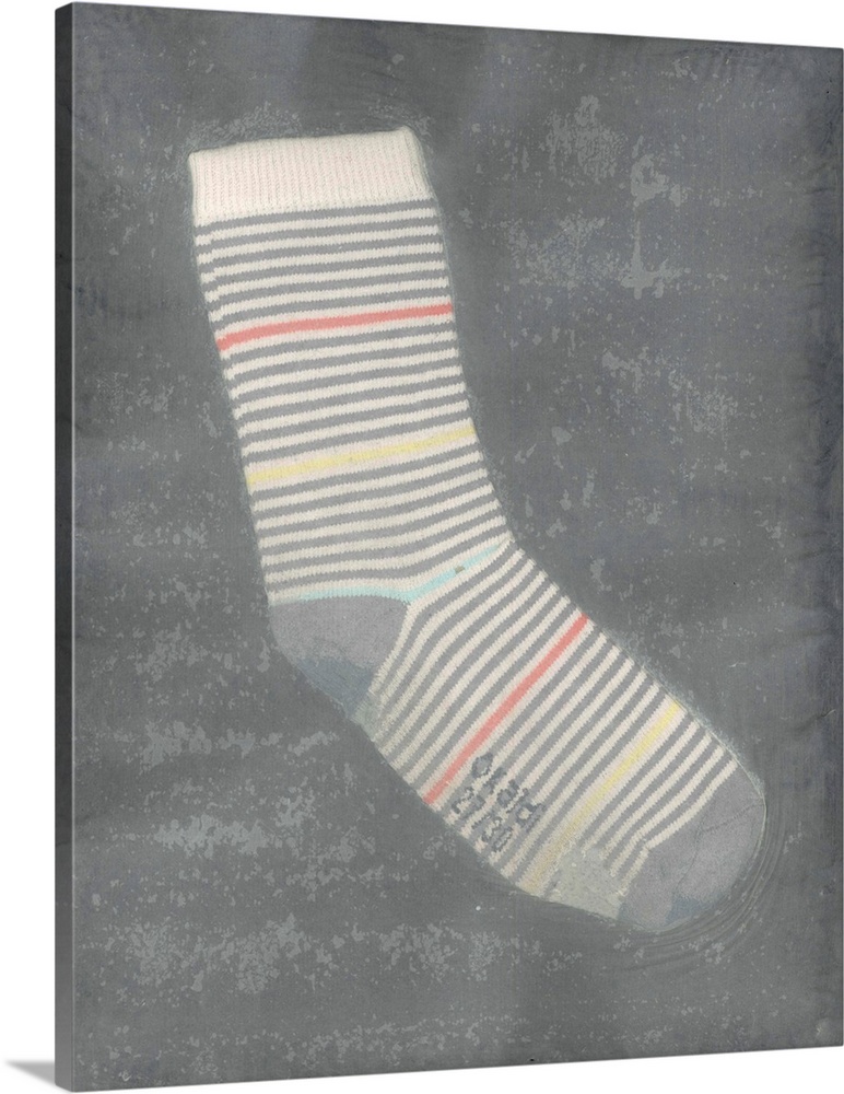A worn, striped children's sock suspended in handmade paper.