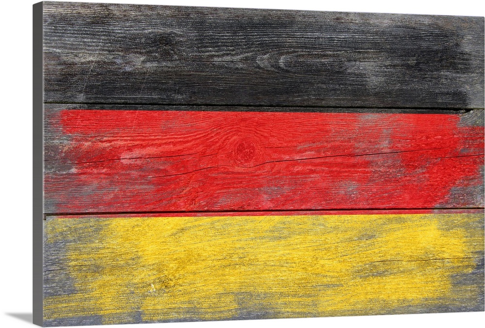 The flag of Germany with a weathered wooden board effect.