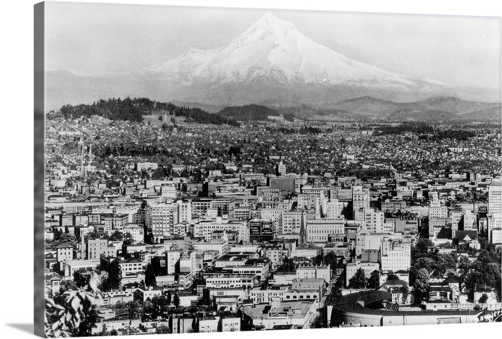 Vintage photograph of the city of Portland, Oregon, with Mount Hood in the distance.
