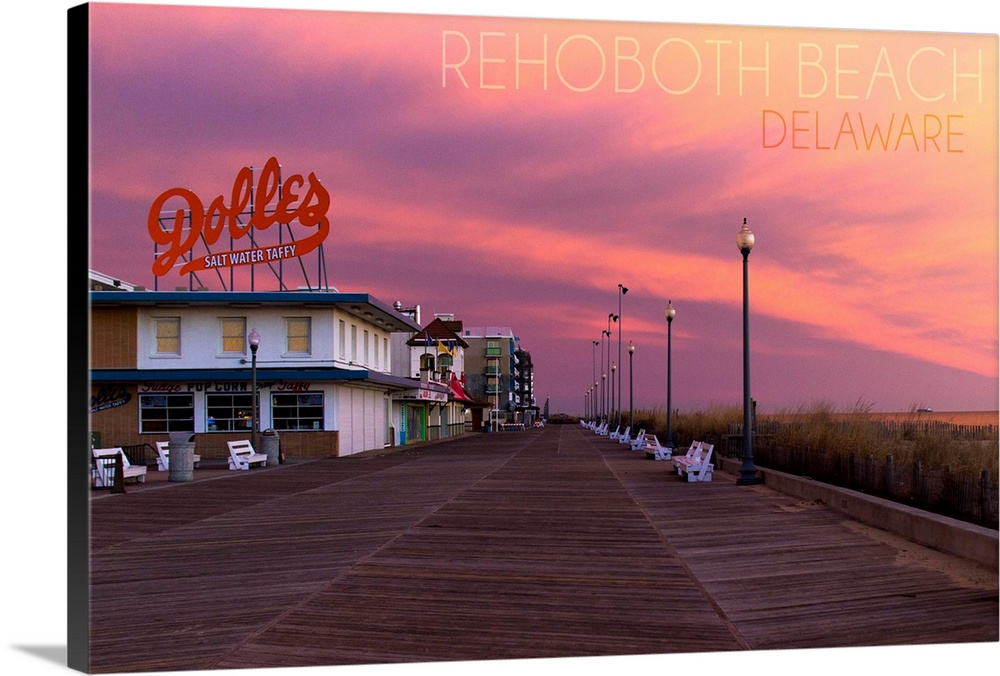Photograph of Rehoboth Beach, Delaware of the Dolles candy store and vibrant sunset.
