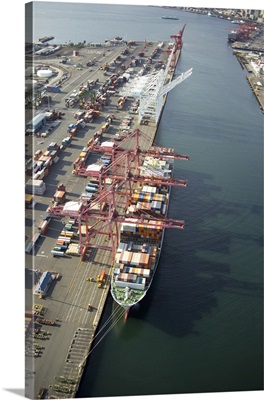Cranes loading a container ship at Port of Seattle, WA, USA - Aerial Photograph