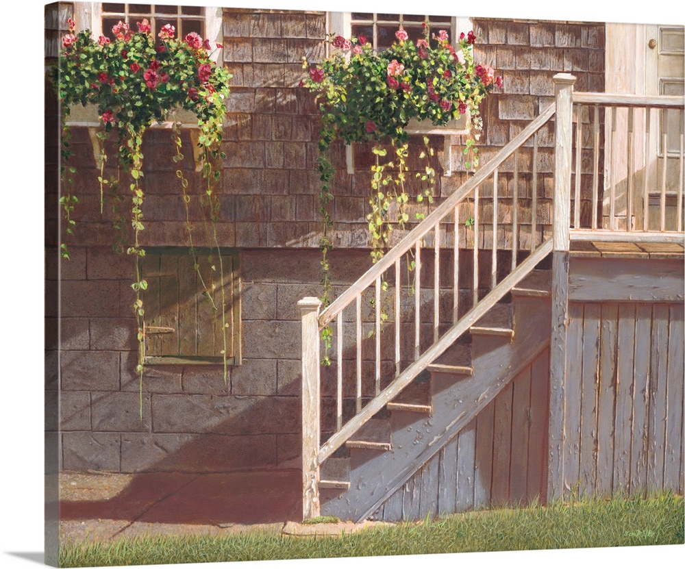 Stariway into a house with window flower boxes above.