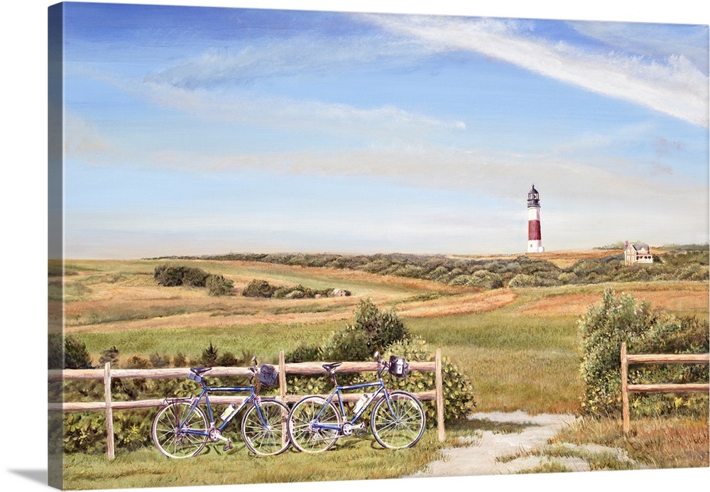 Two bicycles against a fence by a path with a field of grass, lighthouse and house.
