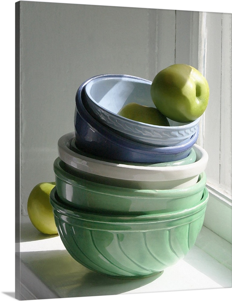 A stack of ceramic bowls with green apples on a windowsill.