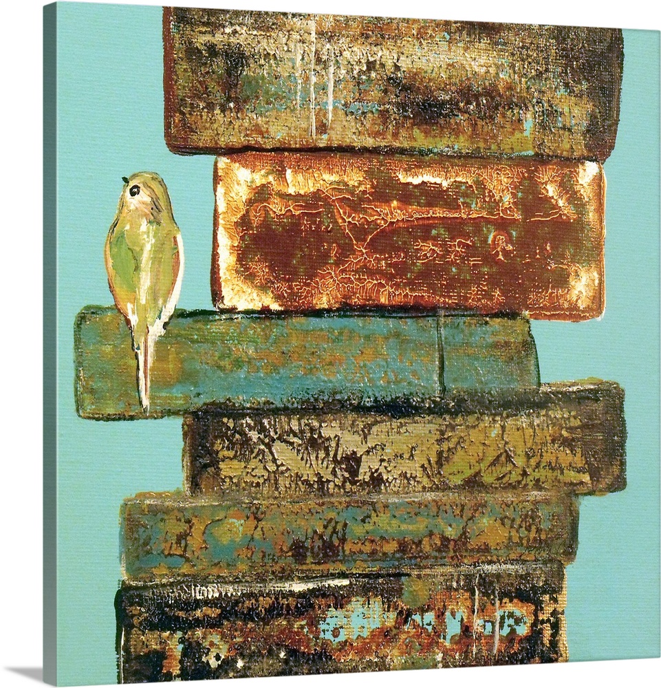 A small bird perched on the edge of a stack of weathered books.