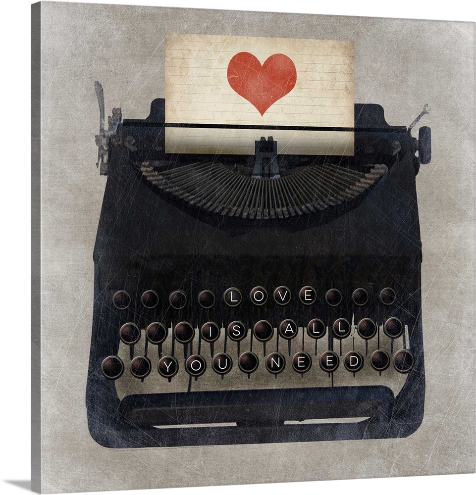 A vintage typewriter with "Love is all you need" on the keys and a heart on the paper.