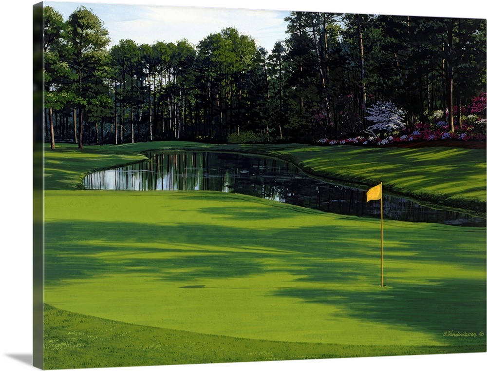 Photograph of the greenway on a golf course with a small pond and trees just behind it.