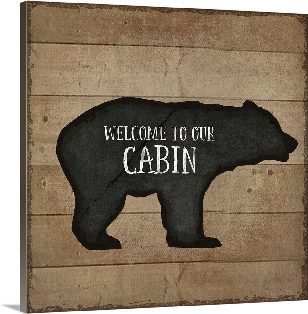 "Welcome to Our Cabin" on a bear silhouette over a wooden background.
