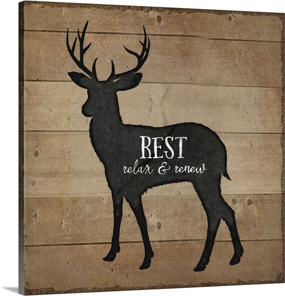 Cabin decor of a deer silhouette on a wooden board background.