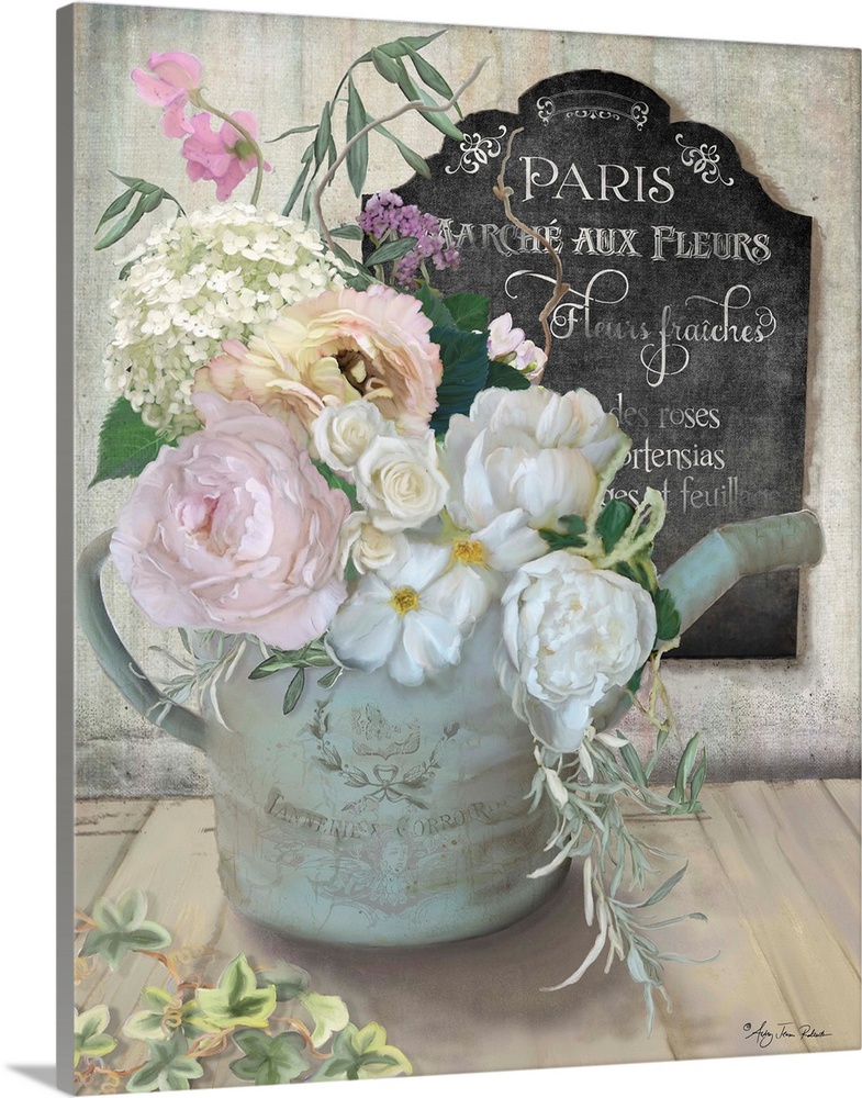 A bouquet of roses and peonies in an old watering can next to a chalkboard sign.