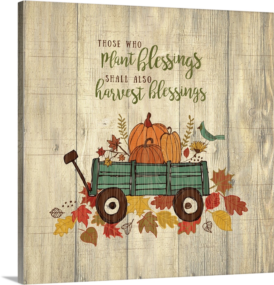 Thanksgiving themed decor of a wagon filled with pumpkins on a leafy trail.