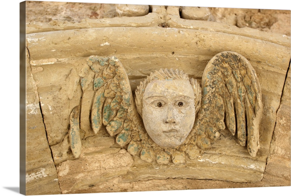 Italy, Apulia, Otranto, angel carved in stone in a door archway