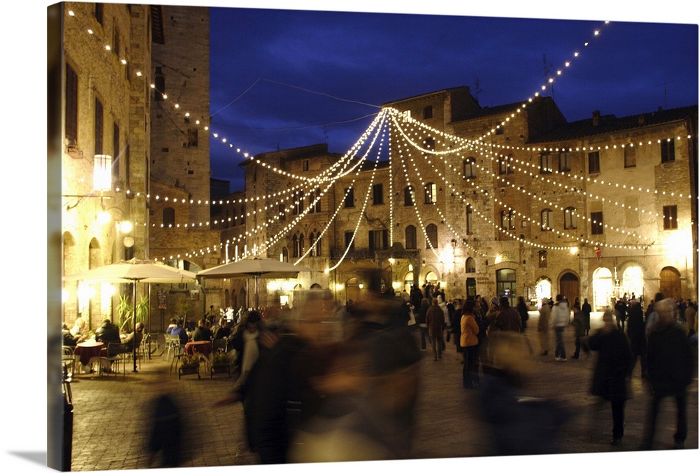 Evening stroll in the central square, under Christmas decorations.

San Gimignano is a small walled medieval hilltop tow...