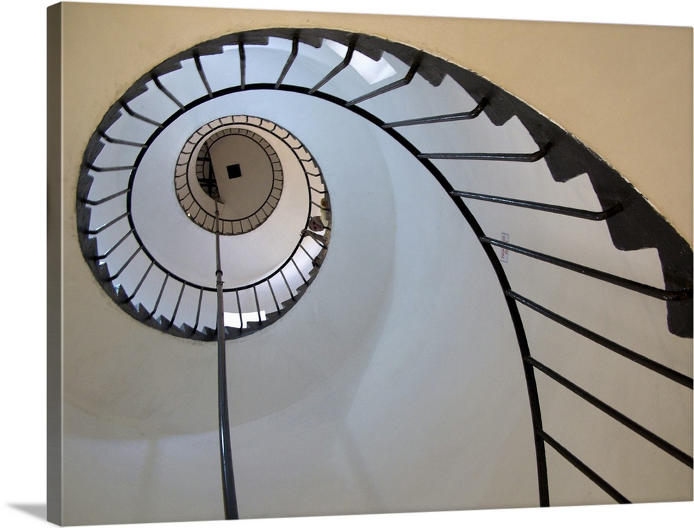 Decorative artwork of a spiral staircase taken from below and looking up.