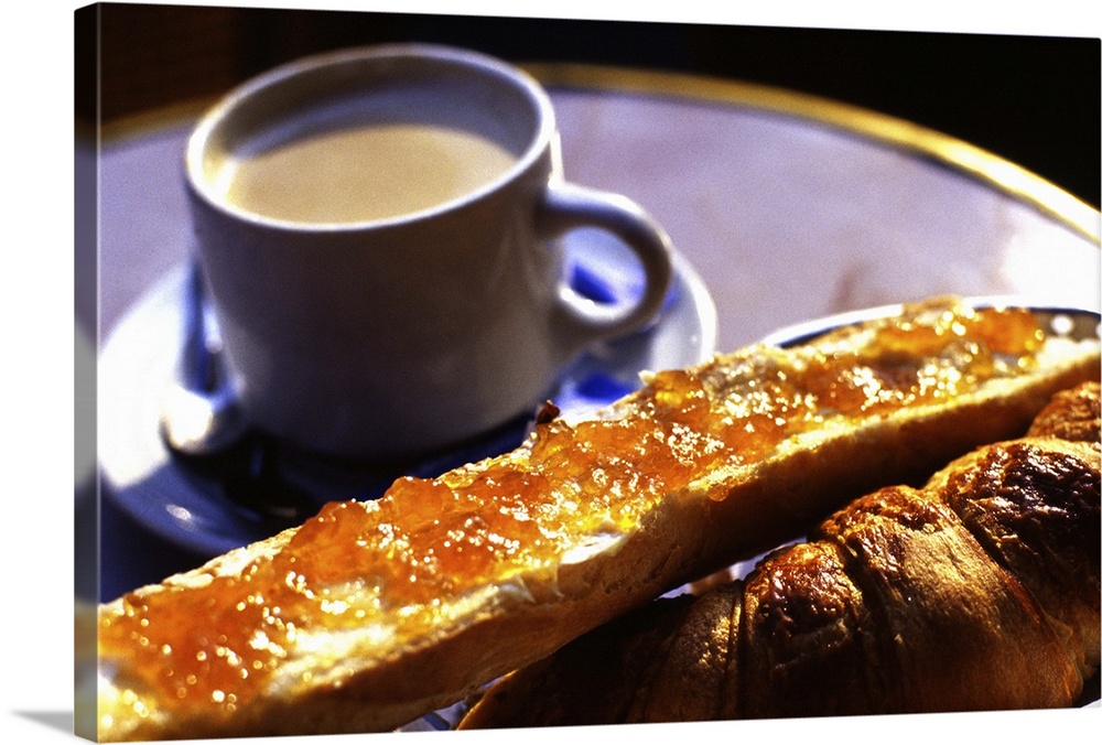 France: morning breakfast: cafe au lait, croissant and french bread with butter and marmelade