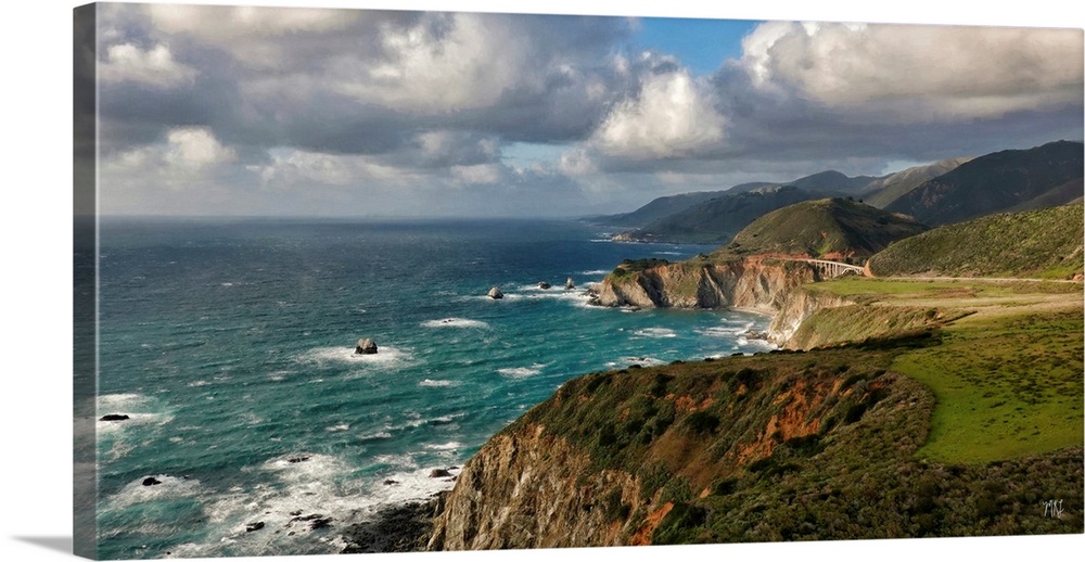 A view of the Big Sur coastline from Hurricane Point, with the Bixby Creek Bridge glowing in the sunlight.