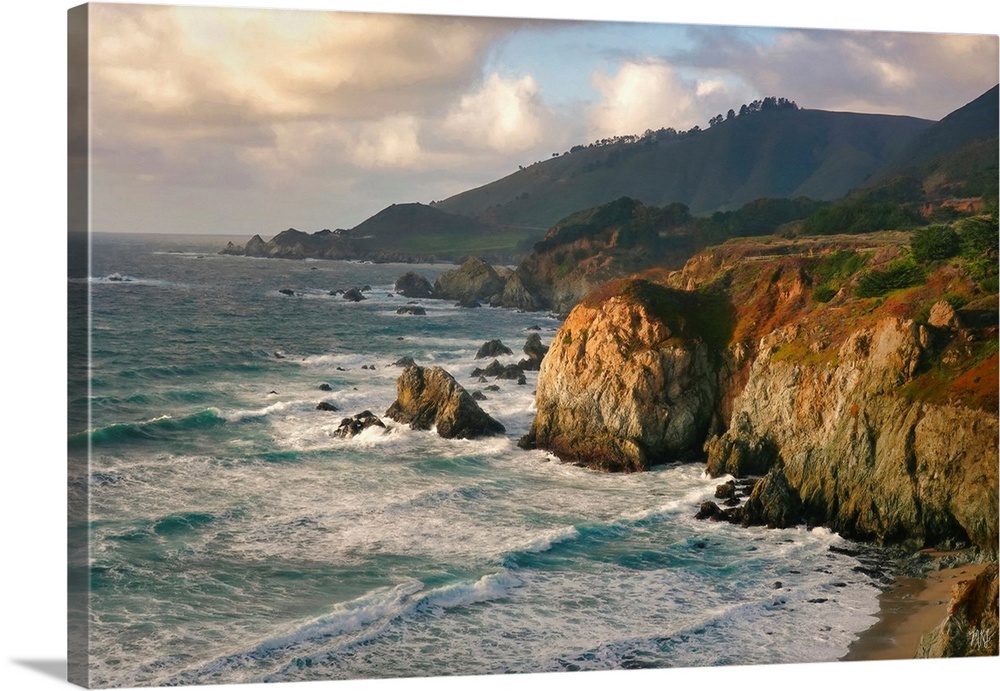 The ocean meets a spectacular rock formation near Rocky Creek Bridge in Big Sur, and the teals and blues of the water cont...