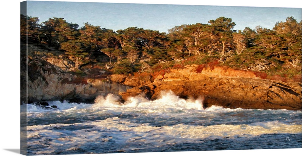 The setting sun casts a warm glow as waves surge against the rocky coastline of Cypress Grove in the Point Lobos State Res...