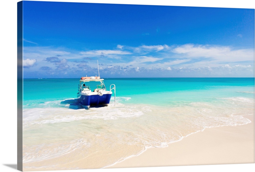 A boat pulled up onto a beach on a private island in the Turks and Caicos Islands.