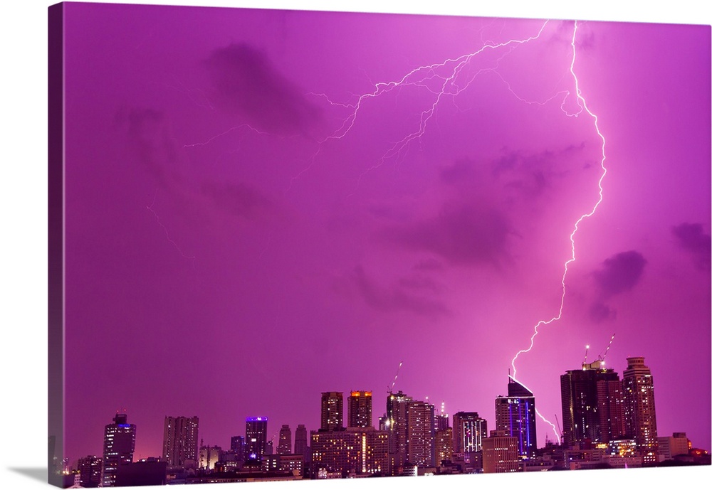A intense thunderstorm with lightning over the skyline of Manila.