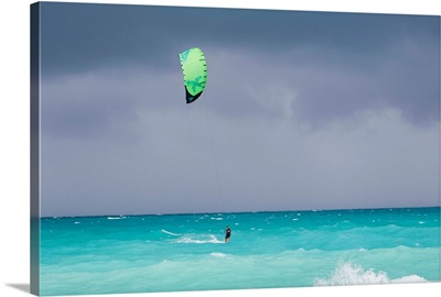 A kiteboarder enjoying gusty winds created by Hurricane Tomas
