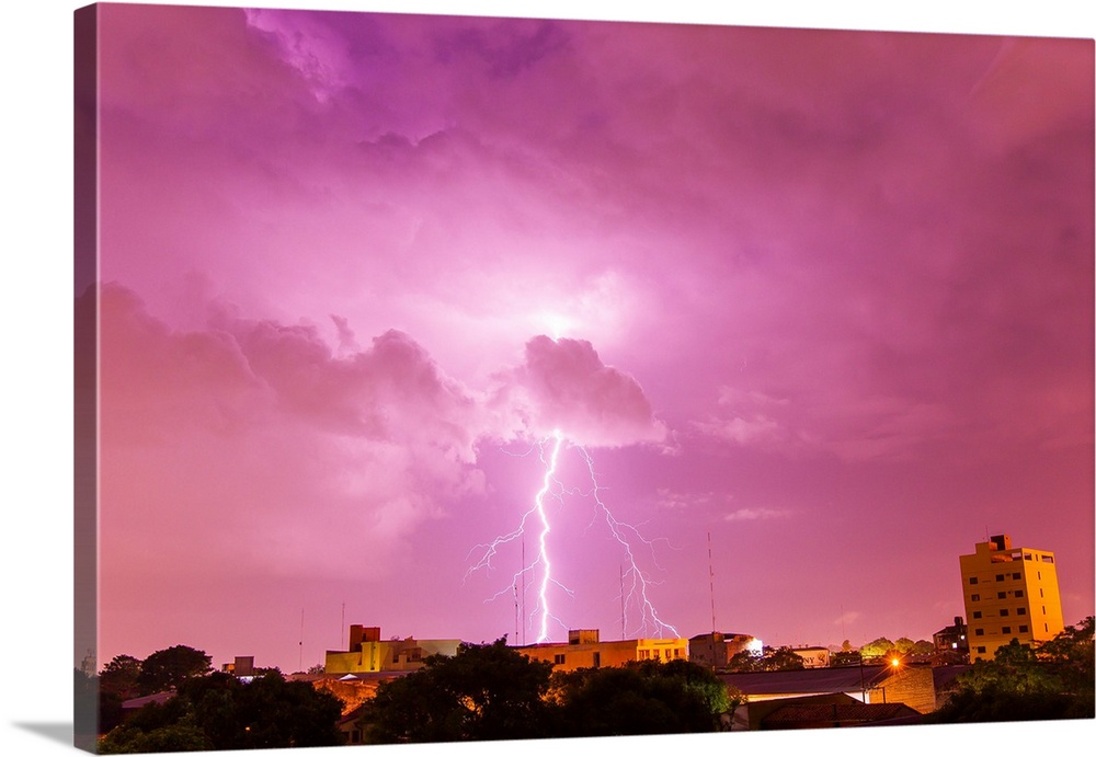 A powerful lightning storm with frequent lightning bolts striking downtown Asuncion, Paraguay.