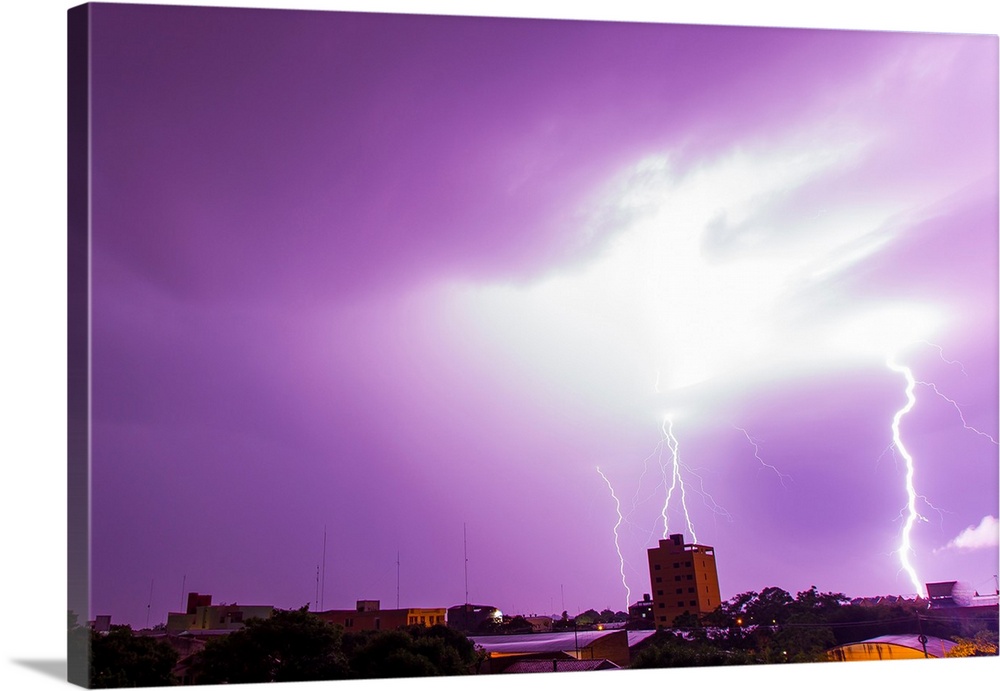 A powerful lightning storm with frequent lightning bolts striking downtown Asuncion, Paraguay.