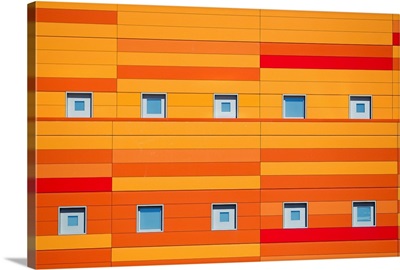 An modern building decorated with bright orange stripes