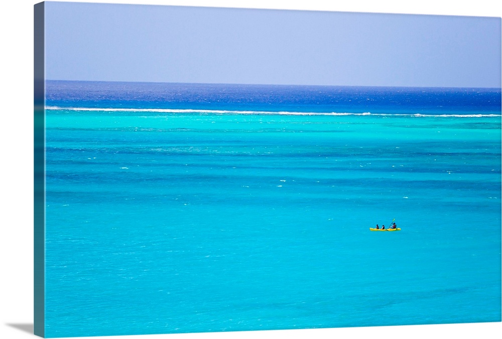 Kayakers in the turquoise waters of Grace Bay, in the Turks and Caicos Islands.