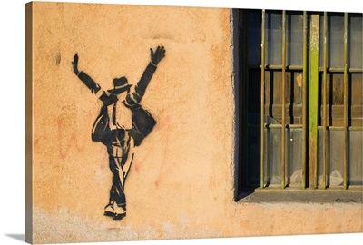 Michael Jackson stenciled on a wall near a window