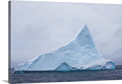 Tabular iceberg with a point in Antarctica
