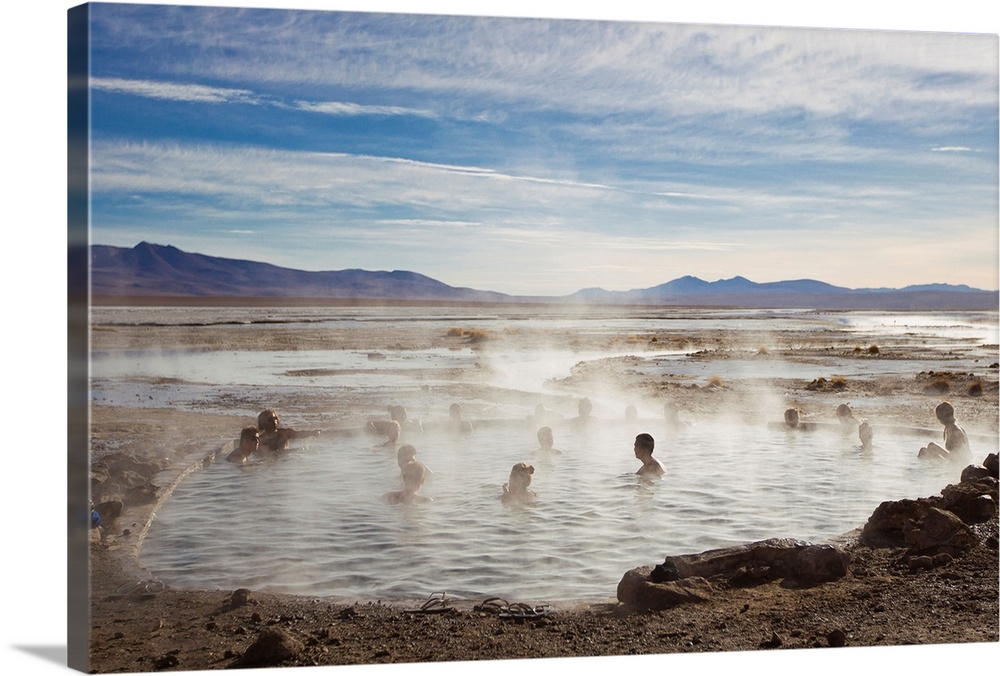 Tourists enjoying natural hot springs in Bolivia's altiplano.