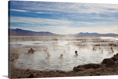 Tourists enjoying natural hot springs in Bolivia's altiplano